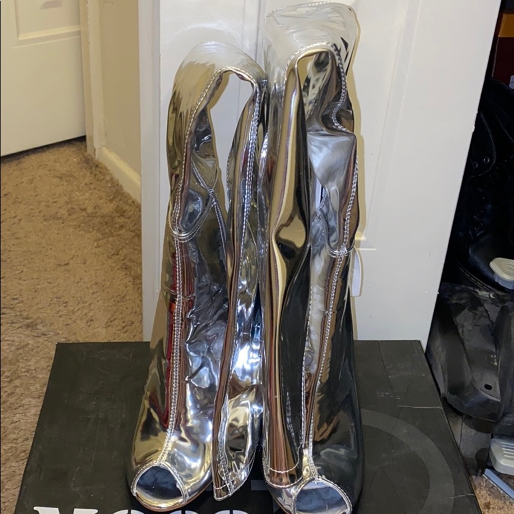 Silver shinny heel boots.